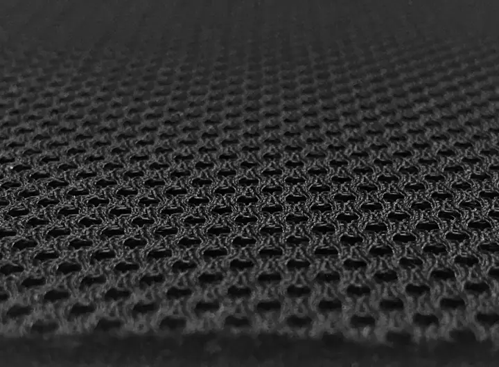 Close-up of 601 fabric in black, featuring a 3D spacer mesh structure for enhanced breathability, cushioning, and performance in technical textile applications.