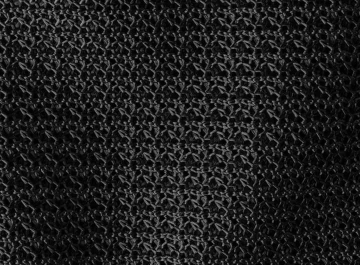 Close-up of 800 fabric in black, featuring a durable and breathable open-knit mesh ideal for industrial, safety, or performance textile applications.