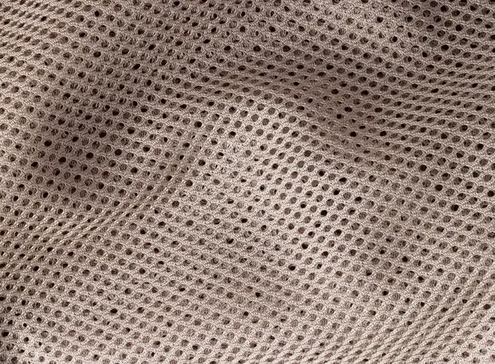 Close-up of 1967 fabric in taupe, featuring a lightweight circular knit mesh design ideal for breathability, flexibility, and comfort in various applications.