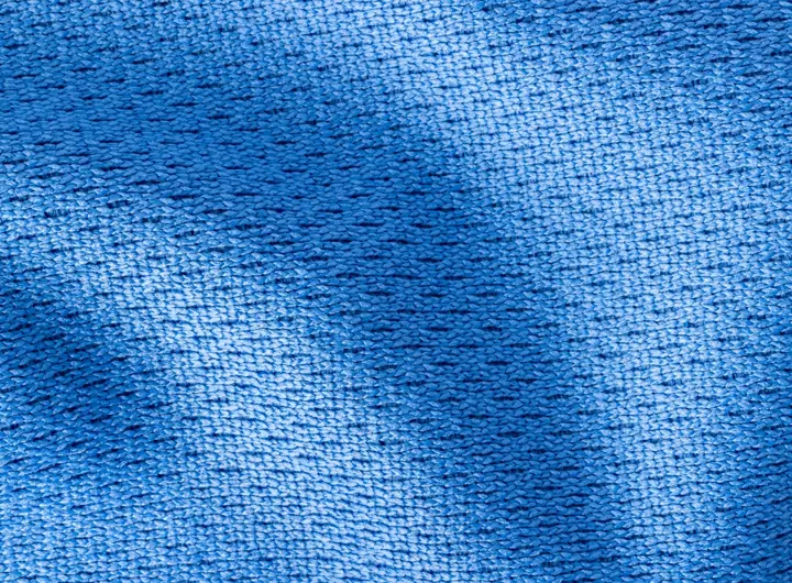 Close-up view of 280LP fabric in vibrant blue, showcasing its tightly knit, textured surface ideal for performance, activewear, and durable textile applications.