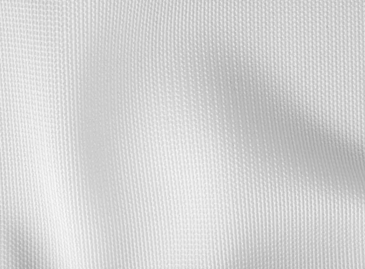 Close-up of 1920 12 fabric in white, featuring a smooth, fine-knit texture designed for durability, flexibility, and use in performance or technical textiles.